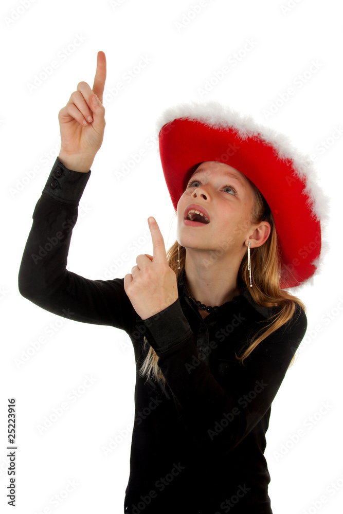 girl with christmas hat is pointing over white background girl with christmas hat is pointing over white background