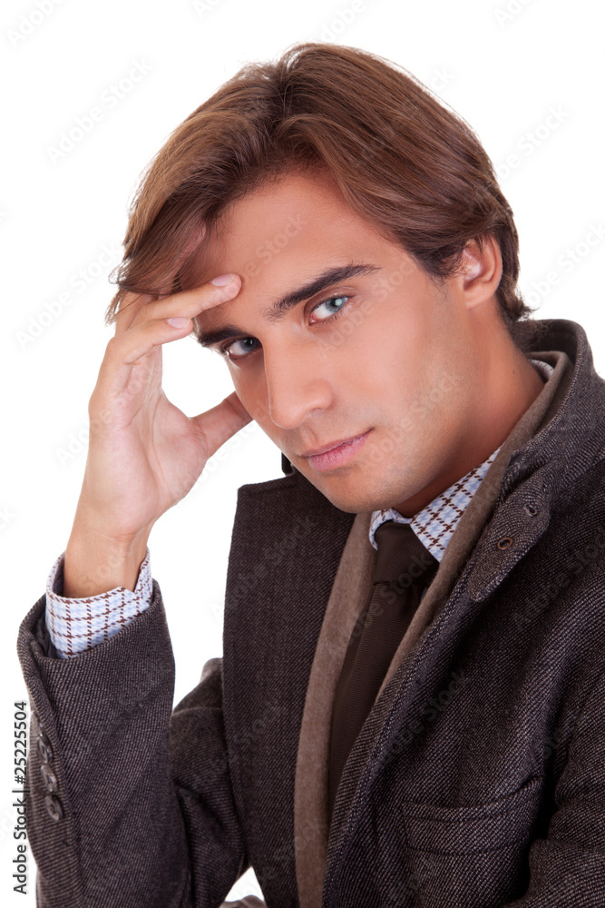 young businessman thinking, in autumn/winter clothes young businessman thinking, in autumn/winter clothes