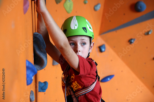 Boy on climbing wall