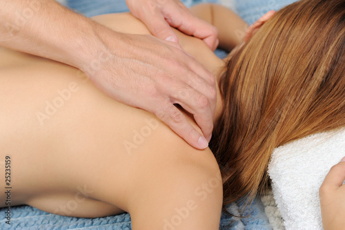 Man massaging woman