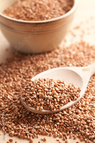 buckwheat in wooden spoon