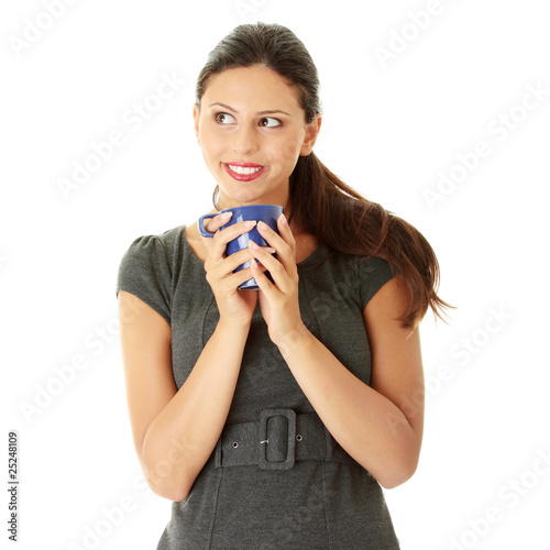 Businesswoman holding coffee cup