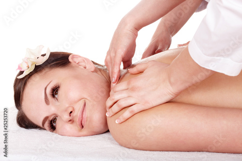Four hands massage of young woman.