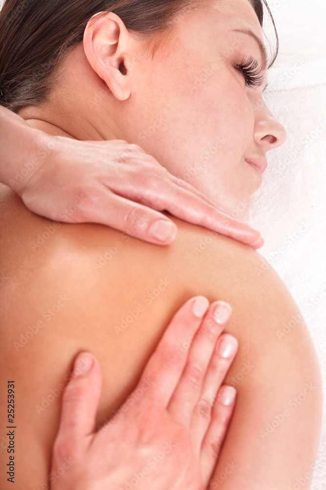 Young woman having massage. Young woman having massage.