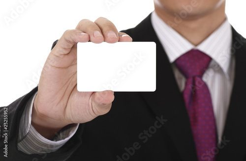 Businessman with blank card. Clipping path included for card