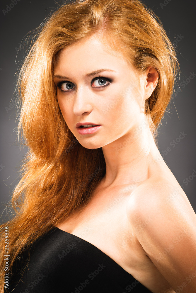 Fototapeta premium Portrait of red-haired woman