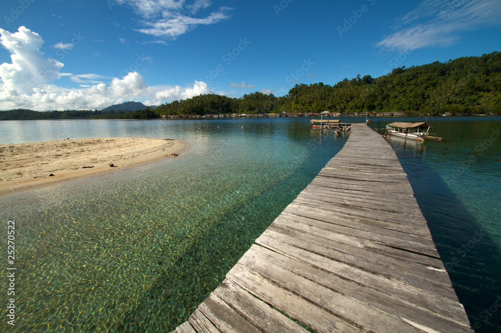 Wooden jetty over tropical beach