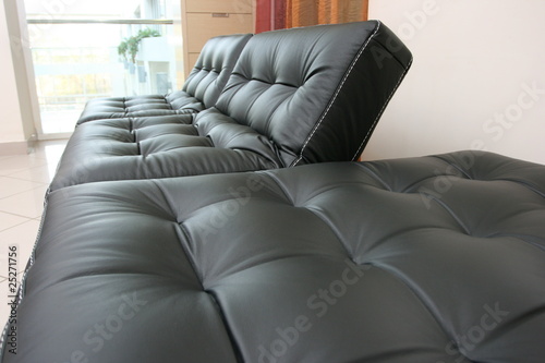 Black leather sofa in office photo
