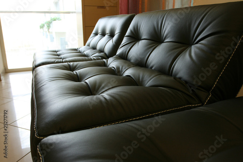 Black leather sofa in office photo