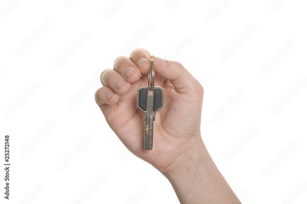 business man hand with a key isolated over white business man hand with a key isolated over white
