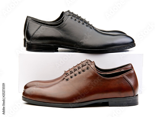 Two pairs of male classic shoes brown and black ones