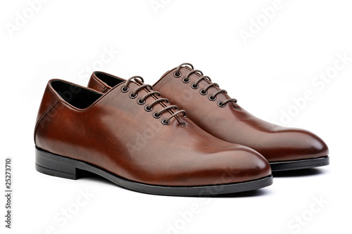 Pair of brown male classic shoes on white background