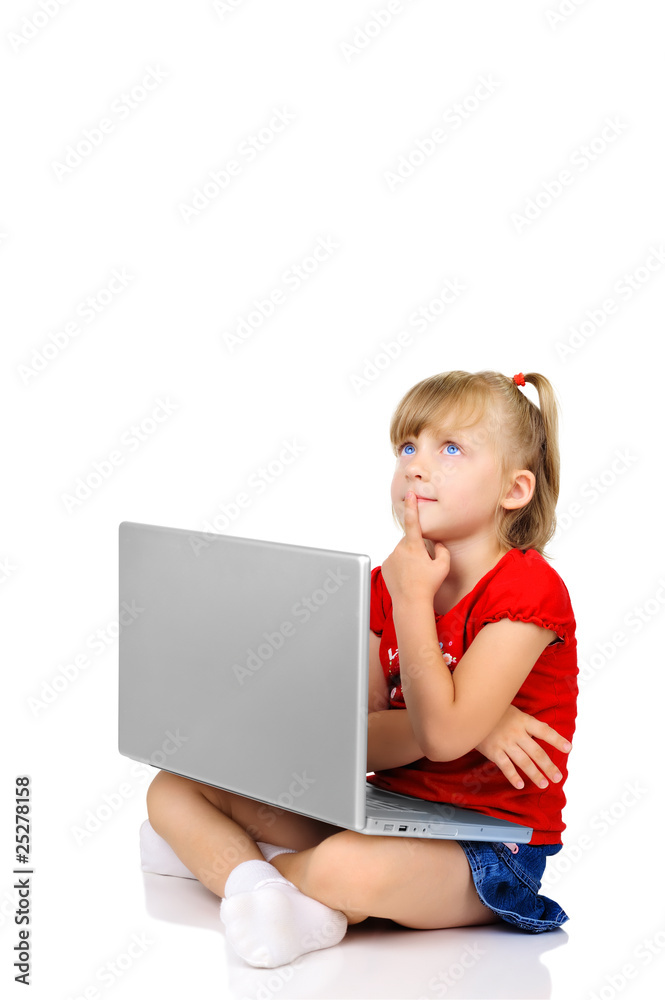 Cute little girl is thinking with a laptop Cute little girl is thinking with a laptop