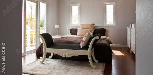 Overall bedroom with white bed & brown sheet