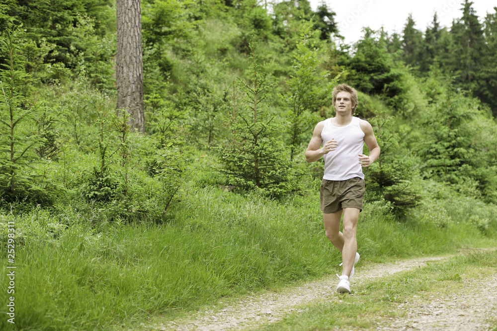 Young man jogging in nature Young man jogging in nature