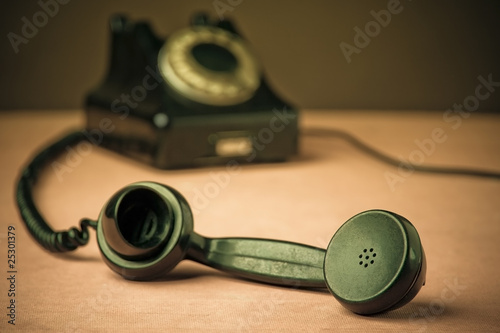 Vintage Rotary Dial Telephone. Soft focus with focus on handset.