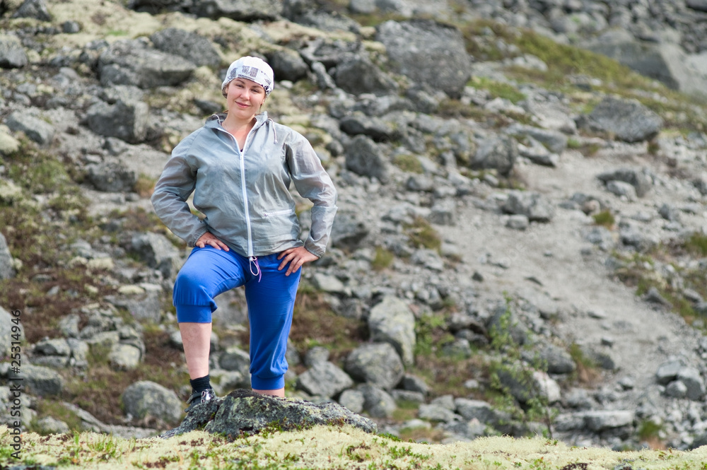 Attractive woman smiling in mountains Attractive woman smiling in mountains