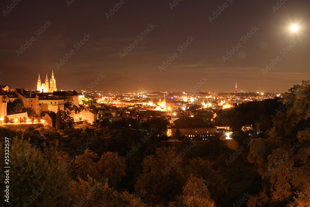 Night View on bright Prague with colorful gothic Castle