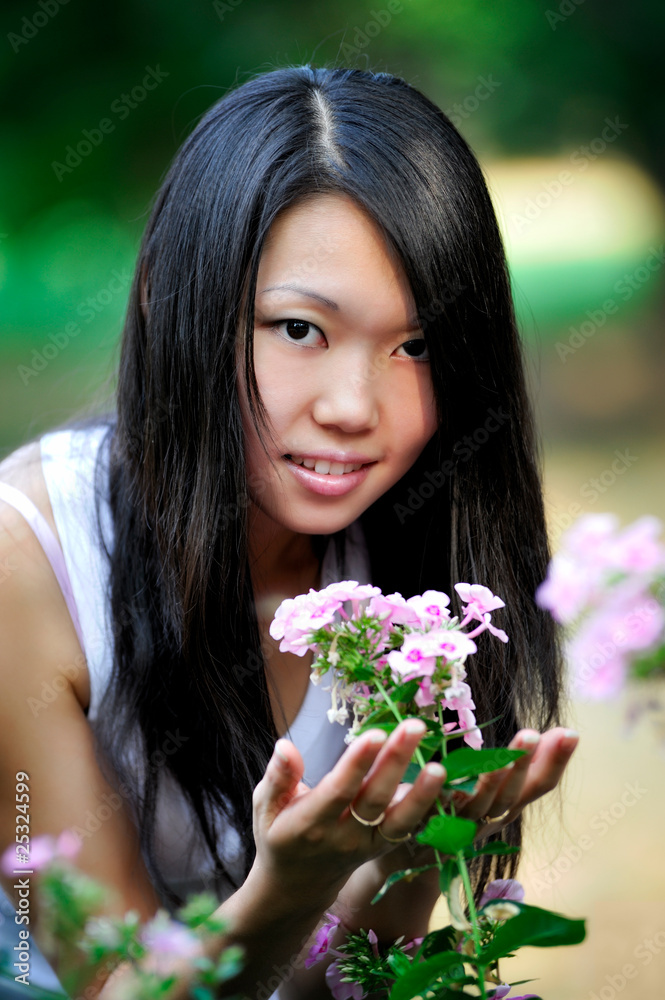 Young asian woman portrait, natural blurred background Young asian woman portrait, natural blurred background