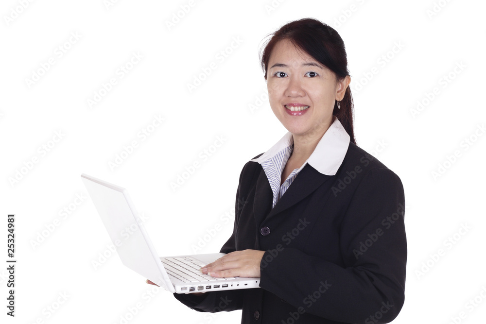 An Asian businesswoman with a laptop An Asian businesswoman with a laptop