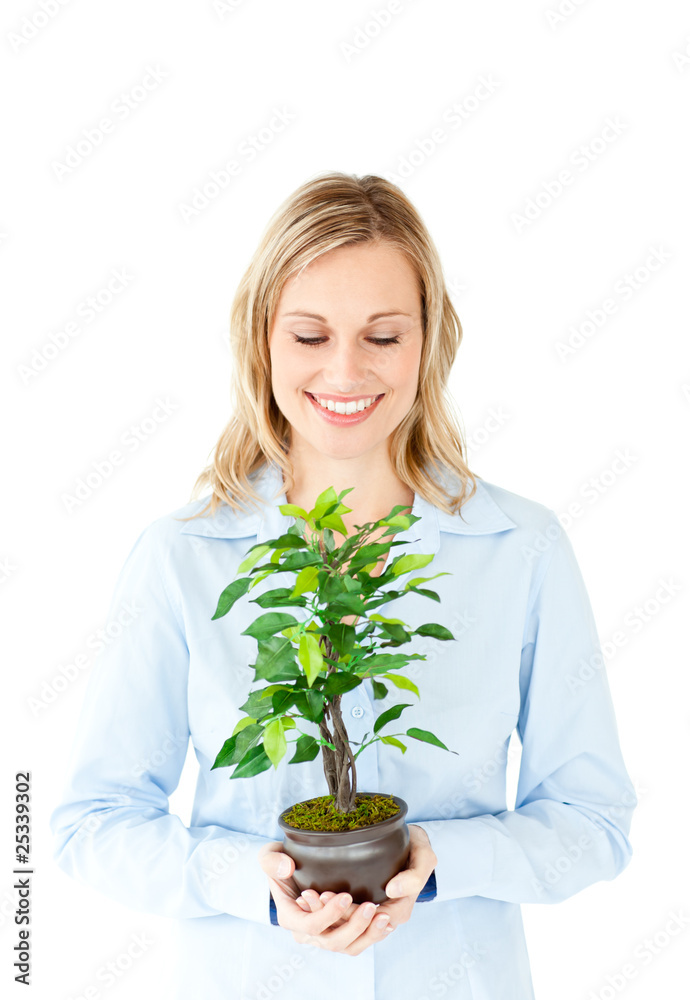 Portrait of a charismatic businesswoman holding a plant Portrait of a charismatic businesswoman holding a plant