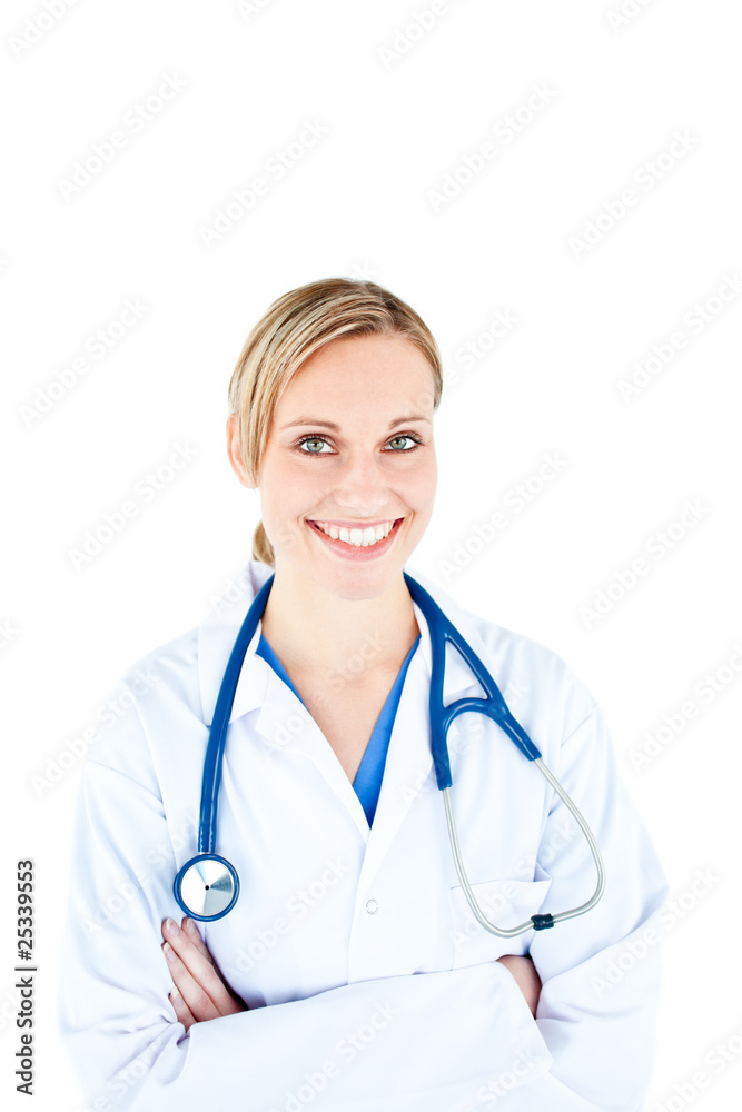Assertive female doctor with folded arms smiling at the camera Assertive female doctor with folded arms smiling at the camera