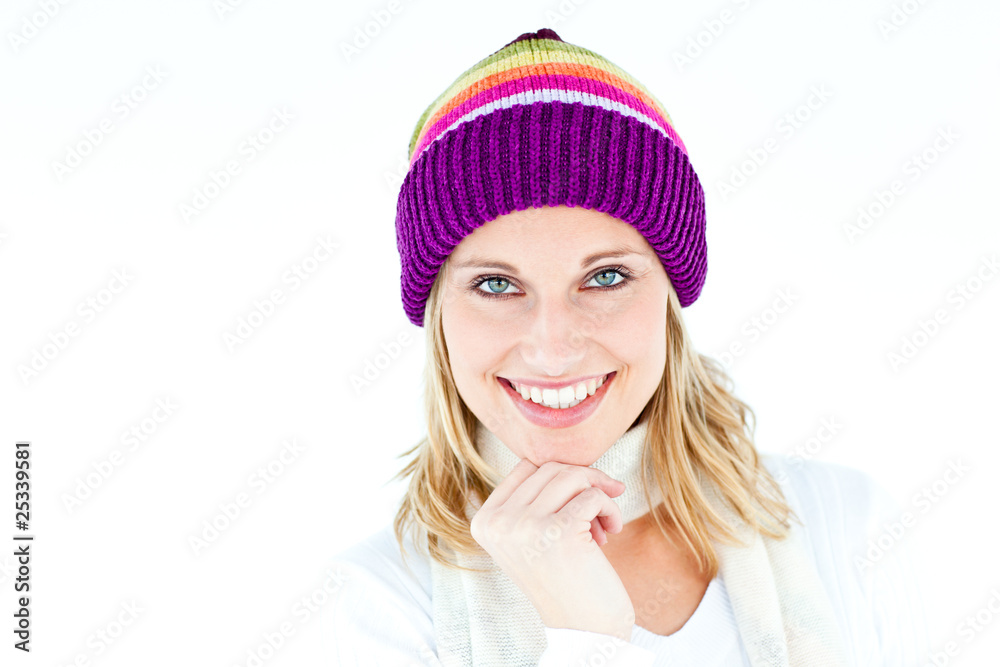 Merry woman with a colorful hat smiling at the camera Merry woman with a colorful hat smiling at the camera