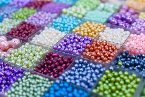 Beads in boxes on a Thai sunday market Chatuchak