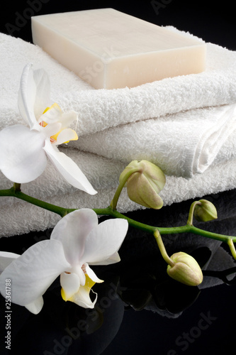 Rectangle soap on white towels on black background