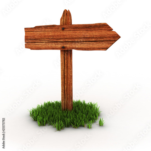 old wooden empty signpost on grass photo