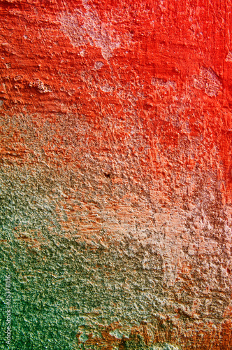 Dirty old wall covered color paints.