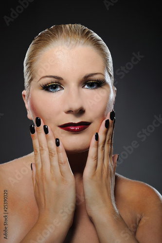 pretty woman with bright make-up and dark manicure