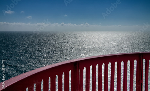 view over the ocean with handrail