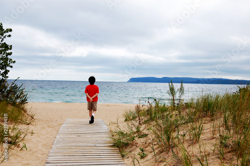 boy walking to beach