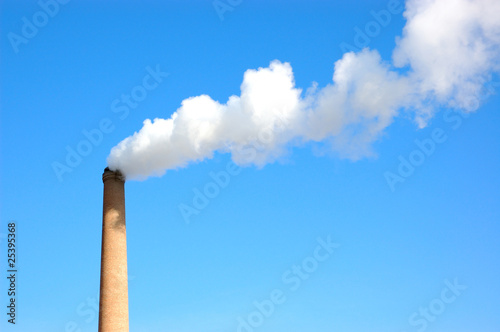 Tall industrial brick chimney venting gasses