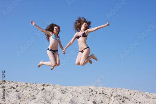 two girls on a sand-pit