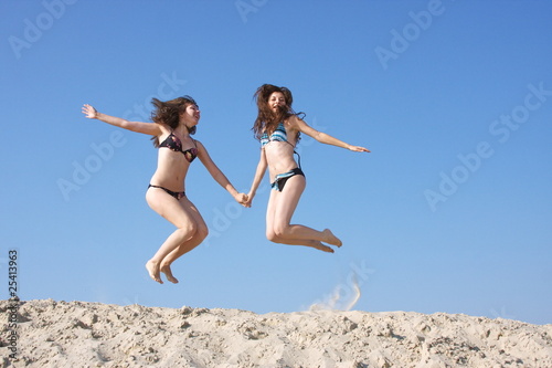 two girls on a sand-pit