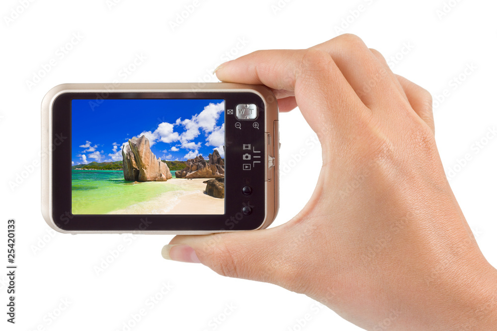 Hand with camera and beach landscape (my photo) Hand with camera and beach landscape (my photo)
