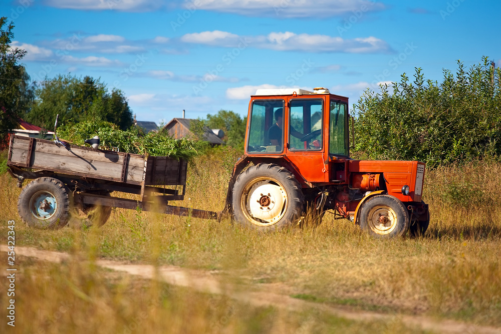 Fototapeta premium Tractor on meadow