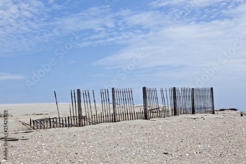 fence for protection of the dunes at the beautiful natural beach