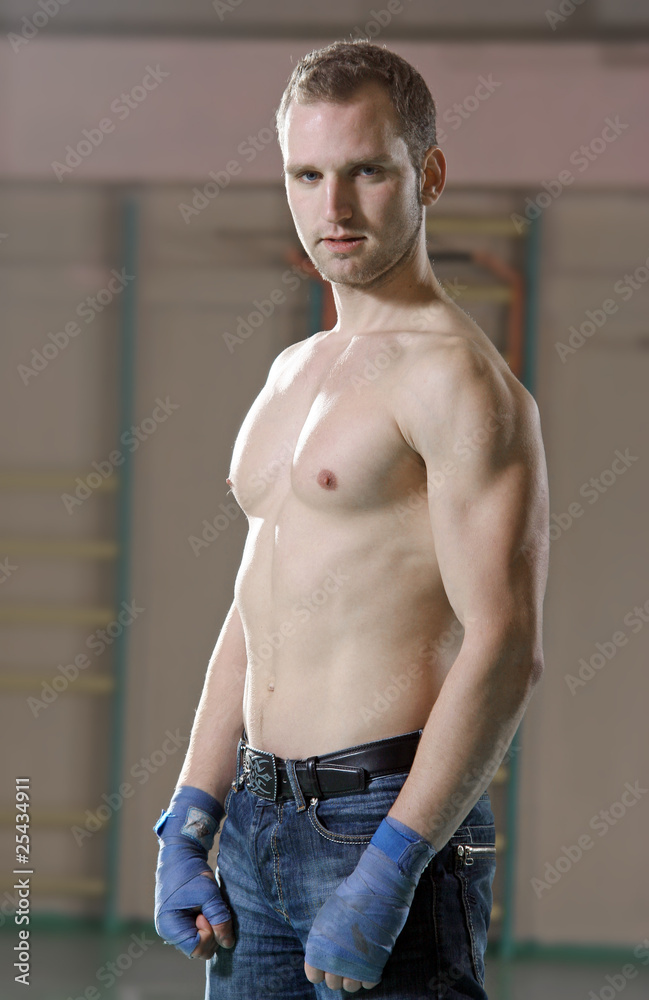 Fototapeta premium Portrait of male boxer in gym