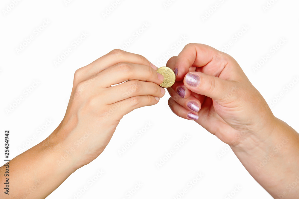 Female hand giving coin to another person Female hand giving coin to another person