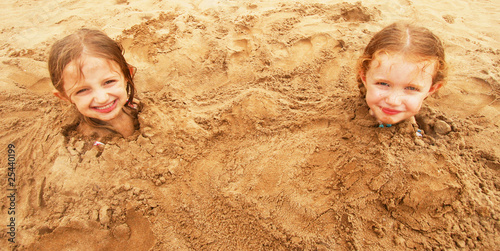 Εκτύπωση καμβά A Pair of Sisters Buried in the Sand at the Beach