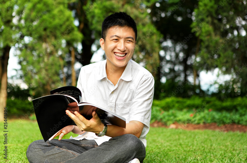 Obraz premium man chat and smile with book outdoor