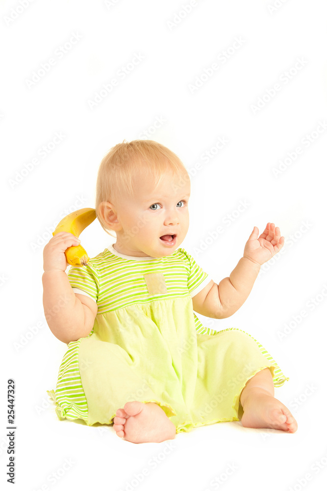 Young little baby eat yellow banana on white Young little baby eat yellow banana on white