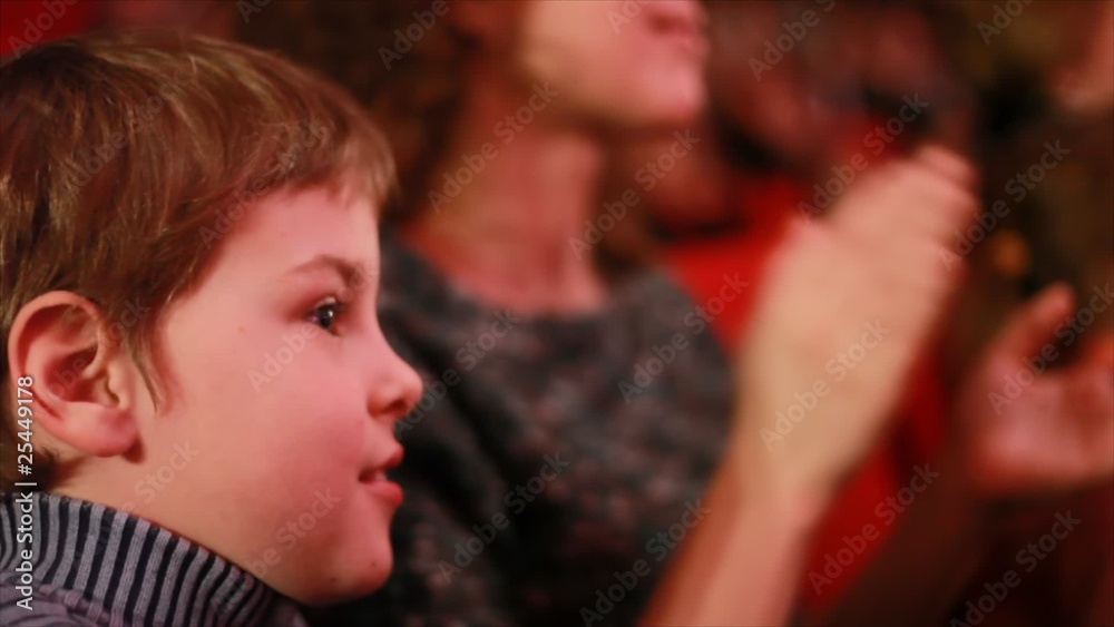 Impressionable boy sits in auditorium of circus, watches show Impressionable boy sits in auditorium of circus, watches show