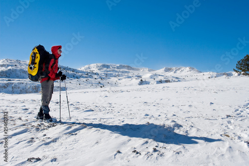 Hiker are in winter mountains