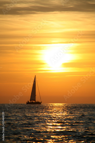 sunset with sailboat © max
