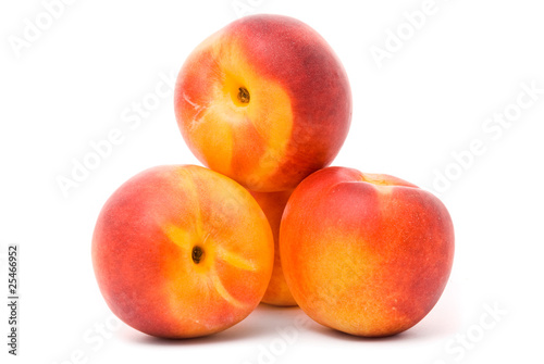 Juicy nectarines on a white background