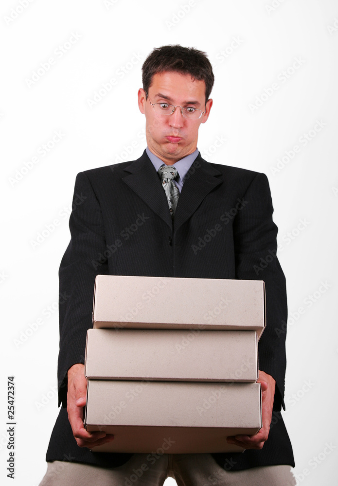 Overloading business man with heavy folders Overloading business man with heavy folders